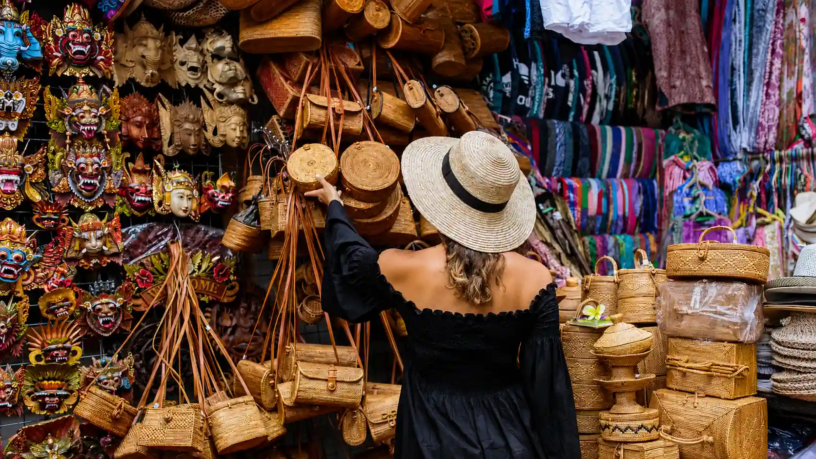 Woman shopping at Ubud Art Market for Bali souvenirs, handicrafts, textiles, and gifts